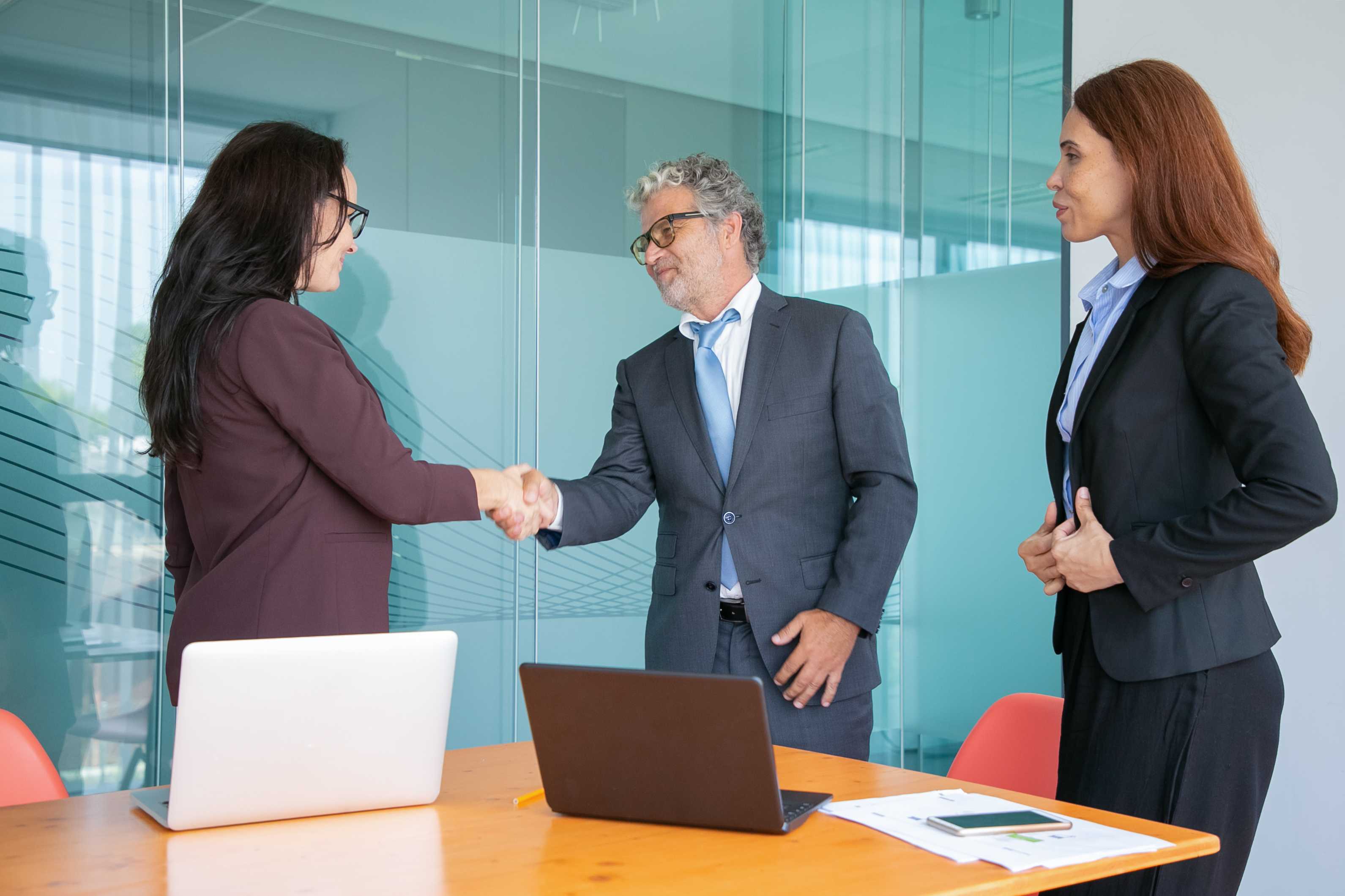 content-businesspeople-handshaking-greeting-each-other (1)